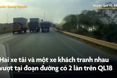[Video] Hai xe tải, một xe khách tranh nhau vượt trên đường hẹp