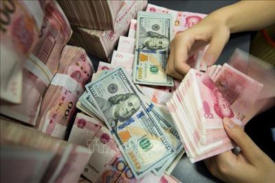 Trung Quốc kiềm chế mức tăng mạnh của đồng NDT so với USD