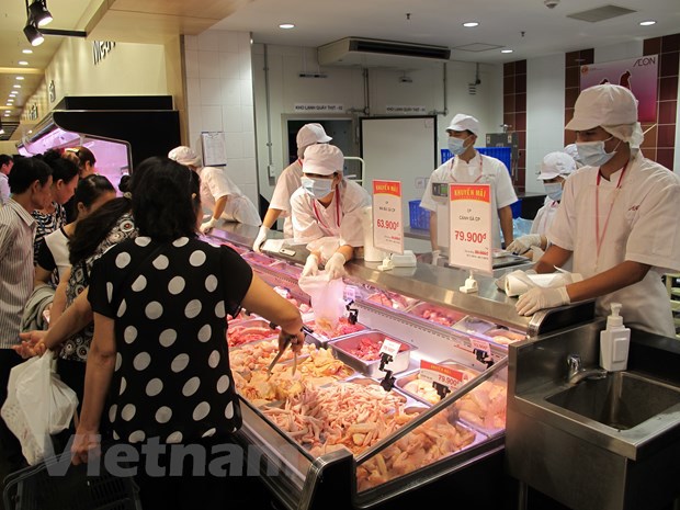 Nhiều doanh nghiệp cam kết đảm bảo bình ổn giá thịt lợn trong dịp Tết. Ảnh: Vietnam+