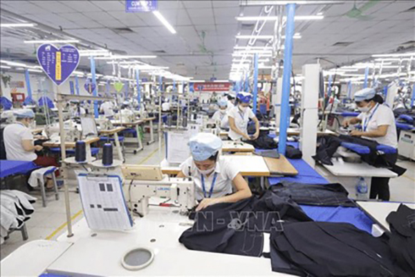 Nhiều doanh nghiệp ở Bắc Giang được vay vốn để trả lương phục hồi sản xuất  Ảnh:TTXVN