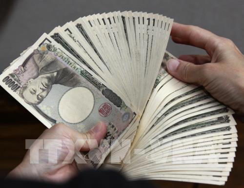 Nhật Bản cần bổ sung ngân sách trị giá 10.000 tỷ yen (92 tỷ USD) để thúc đảy tăng trưởng kinh tế. Ảnh: AFP/ TTXVN  
