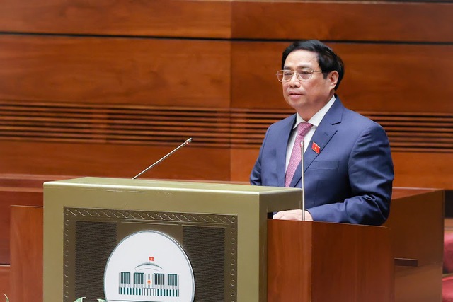 Thủ tướng Phạm Minh Chính trình bày Báo cáo kết quả thực hiện kế hoạch phát triển kinh tế - xã hội năm 2022.