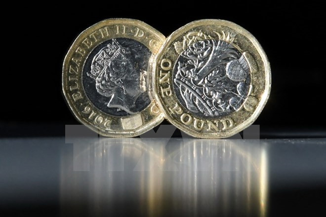 Nước Anh chuyển sang sử dụng đồng xu 1 bảng mới. Ảnh: TTXVN