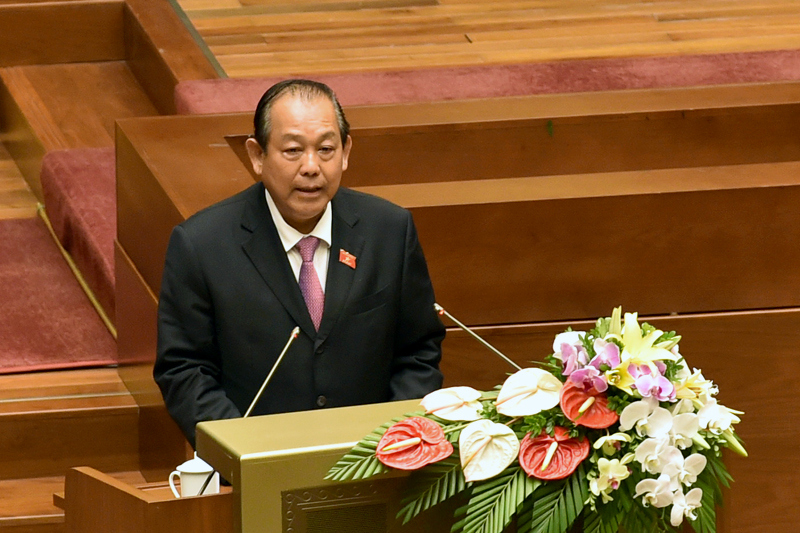 Phó Thủ tướng Thường trực Chính phủ Trương Hoà Bình trình bày báo cáo tại Quốc hội. Ảnh: VGP/Nhật Bắc 