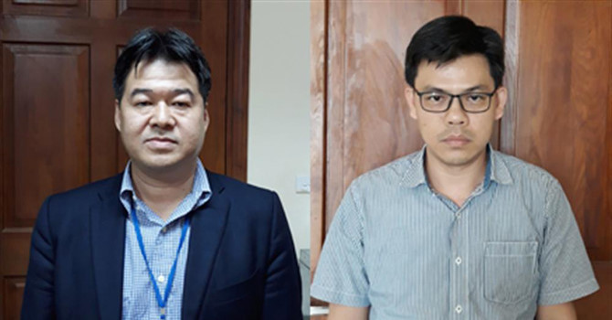 Bị can Nguyễn Hoài Giang (trái) và bị can Phạm Xuân Quang (phải).