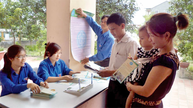 BHXH huyện Nghi Lộc tổ chức tuyên truyền Luật BHYT trên địa bàn. Nguồn: internet.