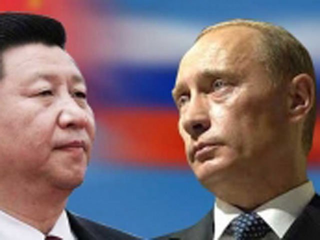 Tổng thống Nga Vladimir Putin (phải) sẽ đến Trung Quốc vào tháng 5-2014. Nguồn: internet