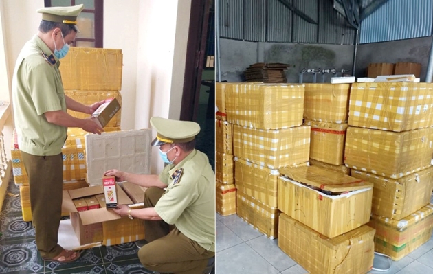 Lực lượng Quản lý thị trường đang kiểm tra kho hàng nhập lậu rượu ngoại tại Bắc Ninh. Ảnh: MK