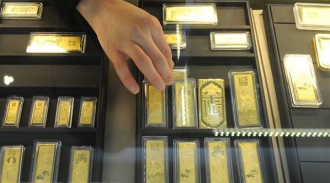 Vàng miếng được bày bán tại một cửa hàng ở tỉnh An Huy, Trung Quốc. (Nguồn: AFP/TTXVN)